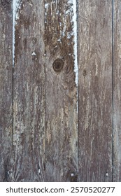 Fragment of a plank shield, with screws and nails, the paint is peeling, close-up, we can see the wood fibers and saw marks, remnants of paint