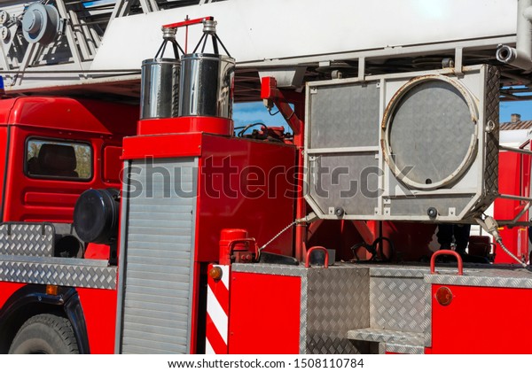 Fragment of a red fire\
engine. Fire technological transport. Fire engines are preparing\
for fire fighting.