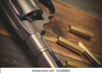 fragment of a revolver Nagan with one bullet in the drum for game Russian roulette. instagram image filter retro style - Shutterstock ID 314588861