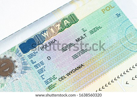 Fragment of Schengen multi entrance Polish visa in passport close-up. Travel Polish visa.