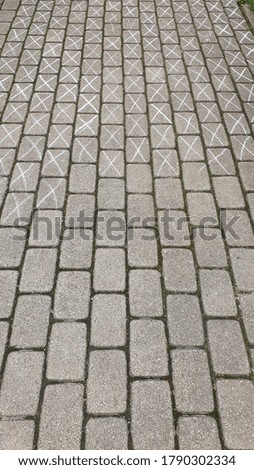 Similar – Pink arrows on the sidewalk