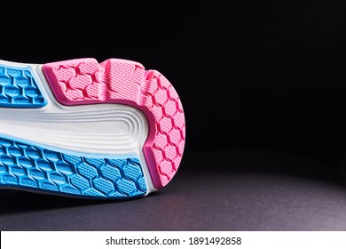 Fragment Of A Sole On Sneaker. The Texture Of The Material Of Sports Shoes. Style Footwear For Running And Training In The Gym.