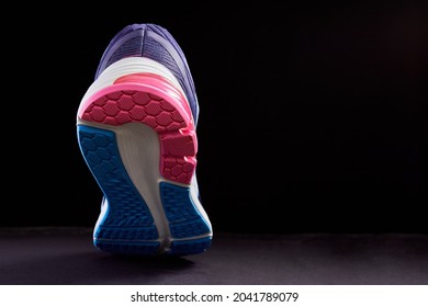 Fragment Of A Sole On Sneaker. The Texture Of The Material Of Sports Shoes. Style Footwear For Running.