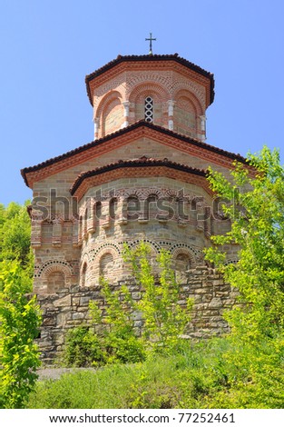Fragment of St.Dimitri Church in ancient city of Veliko Tarnovo in Bulgaria against blue sky background.