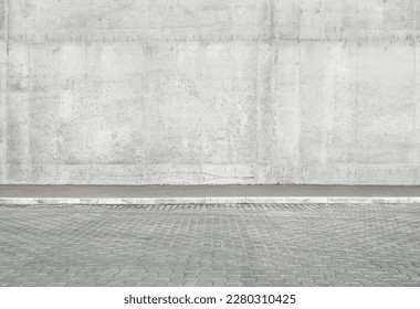 a fragment of a street city concrete wall of a building and an paving stones. Building's facade. Mocap or background for creativity - Powered by Shutterstock