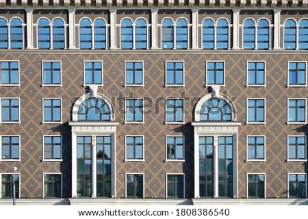 Fragment of Symmetric facade decoration in modern building