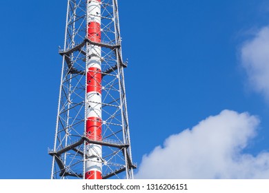 Fragment Of Television Broadcasting Tower Over Cloudy Blue Sky. St.Petersburg, Russia