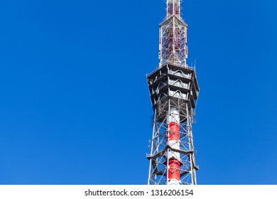 Fragment Of Television Broadcasting Tower Over Blue Sky. St.Petersburg, Russia