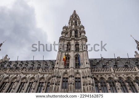 Fragment of Town Hall (Hotel de Ville, 1445) on Grand Place (Grote Markt) - central square of Brussels - most important tourist destination and most memorable landmark in Brussels, Belgium. 
