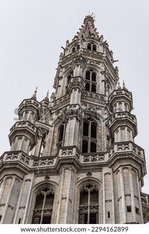 Fragment of Town Hall (Hotel de Ville, 1445) on Grand Place (Grote Markt) - central square of Brussels - most important tourist destination and most memorable landmark in Brussels, Belgium. 