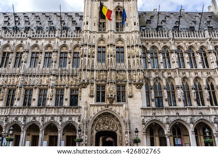 Fragment of Town Hall (Hotel de Ville, 1445) on Grand Place (Grote Markt) - central square of Brussels - most important tourist destination and most memorable landmark in Brussels, Belgium.