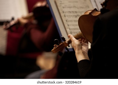  Fragment of a violin in the hands of a musician in a Symphony orchestra