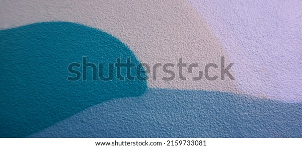 Fragment\
of the wall with colorful graffiti painting in the street. Part of\
colorful street art graffiti on wall\
background