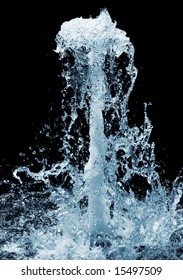 Fragment of a waterfall isolated on the black background