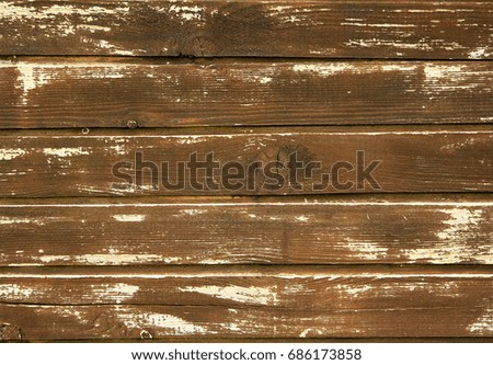 Fragment of a wooden fence in an old house. Building background.