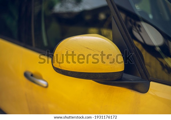 fragment of yellow car hood with mud,\
fragment of yellow dirty car, close-up and selective focus,\
beautiful texture and color for use as a\
background.