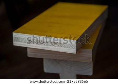 Fragments of 3-ply panel and wooden beams for formwork
