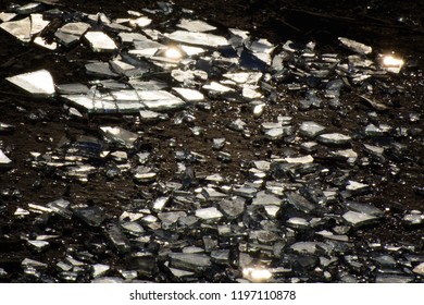 Fragments Of A Broken Mirror On The Ground. They Reflect The Sun.