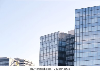 fragments multi-storey office and residential buildings in European city with reflective glass facades, modern high-rise office buildings and residential towers, dynamism contemporary urban life - Powered by Shutterstock