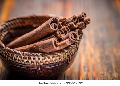 Fragrant cinnamon sticks in bowl - Shutterstock ID 335642132