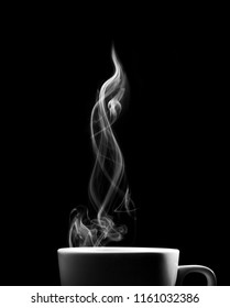 Fragrant Coffee On A Black Background For Your Advertising. Smoke From Hot Coffee.