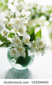 Fragrant Jasmine Bouquet In A Vase On The Table