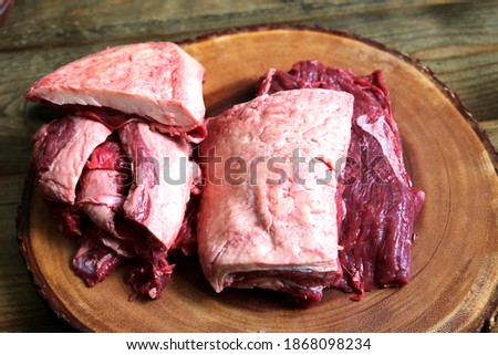 Fraldinha or Flank Steak. Meat cleaned by a butcher on wooden background. meat fat on another board Foto stock © 