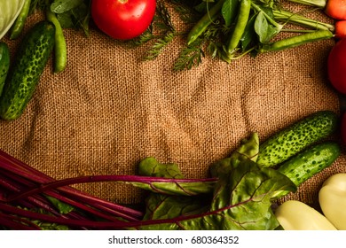 Frame of assorted fresh vegetables as background
