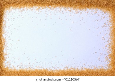 Frame From Brown Cane Sugar On The White Background, Overhead Horizontal View