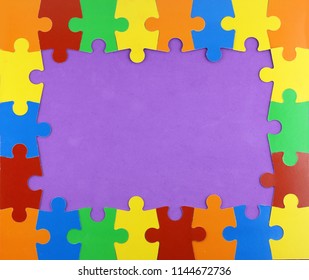 frame of colorful puzzle pieces in a violet background - Powered by Shutterstock