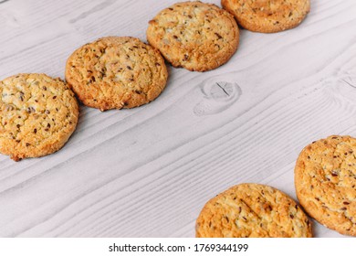 Frame Composition Of Chocolate Chip And Oatmeal Cookies On White Wood Table Background With Copy Space. Image Use For Commercial Or Menu Layout Design. Winter, Autumn, Kitchen. Flat Lay. 