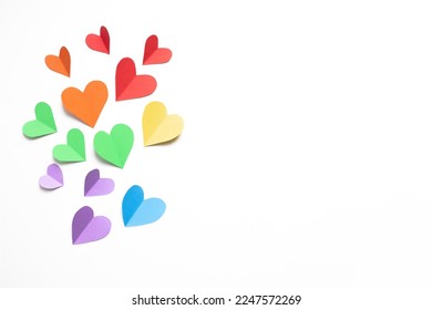 
frame composition with rainbow colored paper hearts  on a white background. concept of valentine's day, lgbt, pride month. copy space. flat lay. top view. - Powered by Shutterstock