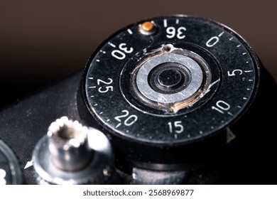 Frame counter disc and shutter button on a film camera