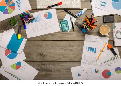 Frame From Different Charts On Wooden Table, Top View