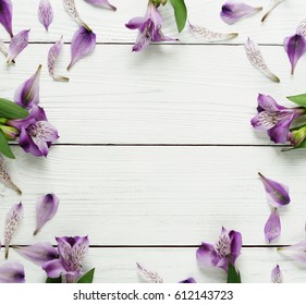 Frame From A Floral Pattern Of Lilac On A White Wooden Background.Top View.Flat Lay.Holiday Concept.Copy Space