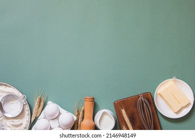Frame of food ingredients for baking on a green pastel background. Cooking flat lay with copy space. Top view. Baking concept. Mockup.
