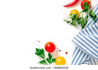 Frame from fresh vegetables and a towel on a white background top view. Copy space for text. Cooking concept, healthy eating or diet. Food background.