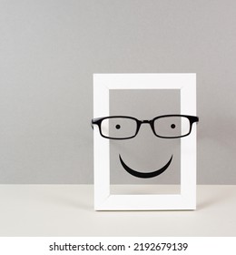 Frame With A Happy Face With Eyeglasses, Mental Health Concept, Positive Mindset And Emotion, Support And Evaluation Symbol