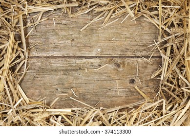 Frame Of Hay On Rustic Wooden Floor With Space For Text