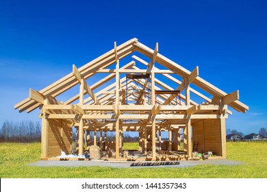 Frame house under construction. Construction site on a sunny day. House from laminated veneer timber. Remodeling of the cottage. The house wooden base. Houses to order. Production of wooden houses.