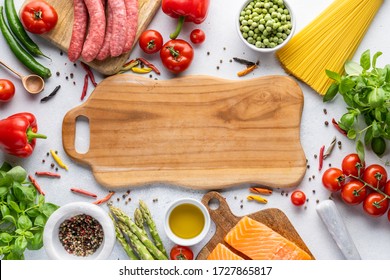 Frame of ingredients for cooking Italian pasta and fish, meat and vegetables. The concept of healthy food with home delivery. Top view, place to copy.