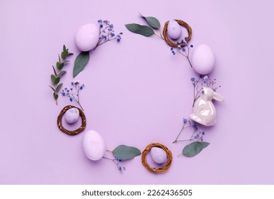 Frame made of Easter eggs, bunny, gypsophila flowers and eucalyptus branches on lilac background - Shutterstock ID 2262436505
