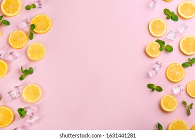 Frame Made Of Lemon Slices, Mint And Ice On Pink Background, Top View With Space For Text. Lemonade Layout