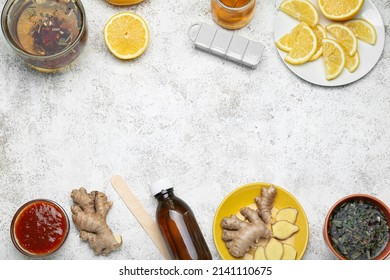 Frame Made Of Medications For Sore Throat, Tea Cups, Lemon Slices And Ginger On Light Background