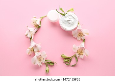 Frame made of natural cream with flowers on color background - Shutterstock ID 1472455985