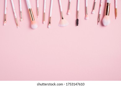 Frame Of Makeup Brushes On Pink Background. Flat Lay, Top View. Make Up Shop Banner Mockup.