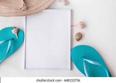 Frame Mockup Elegant Female Straw Hat Blue Slippers Sea Shells On White Background, Copyspace For Text, Summer Vacation, Clean Minimalist Styled Image, Beach Fashion, Flat Lay, Top View