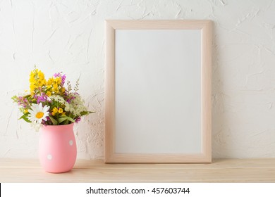 Frame Mockup With Wild Flowers In Pink Vase. Portrait Or Poster White Frame Mockup. Empty White Frame Mockup For Presentation Artwork.