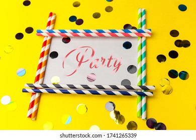 Frame From Multi-colored Biodegradable Paper Tubes With Word Party. The Concept Of Party, Celebration, Birthday. Copy Space On Yellow Background With Multicolored Foil Confetti.