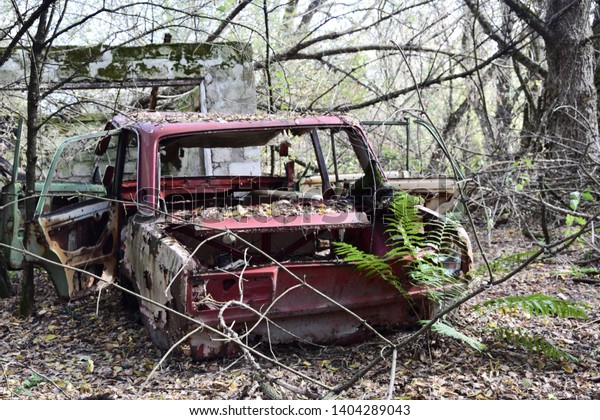 Frame of old\
car in radioactive Chernobyl\
zone.